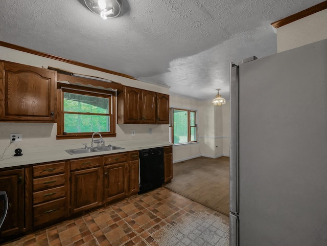 15828 Hedges Rd, Laurelville, OH 43135 - kitchen with freestanding refrigerator, black dishwasher, light countertops, a textured ceiling, and crown molding