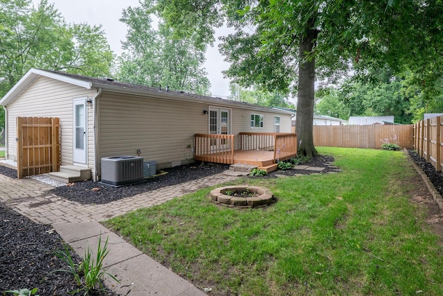 160 Cliff St, Buckeye Lake, OH 43008 - back of property featuring a fenced backyard, a deck, and a fire pit