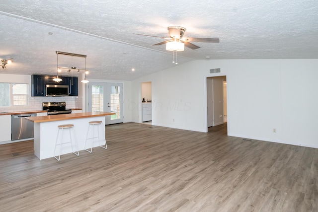 160 Cliff St, Buckeye Lake, OH 43008 - kitchen featuring stainless steel appliances, butcher block counters, open floor plan, light wood-style floors, and a textured ceiling