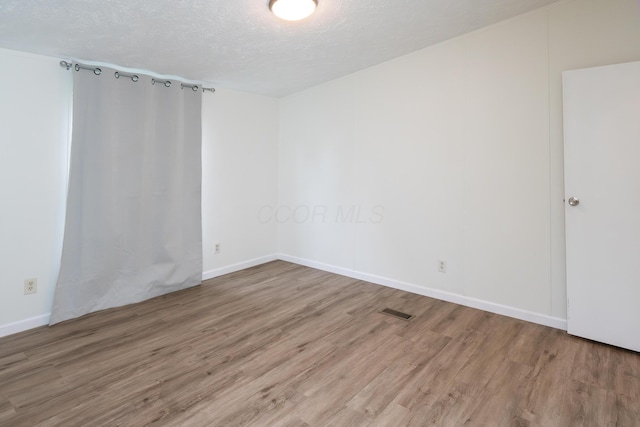 160 Cliff St, Buckeye Lake, OH 43008 - spare room featuring wood finished floors and a textured ceiling