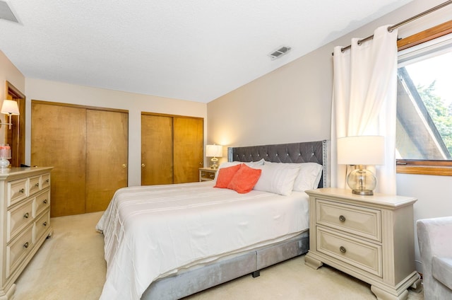 7179 Inverness Ct, Dublin, OH 43016 - bedroom featuring light carpet and multiple closets