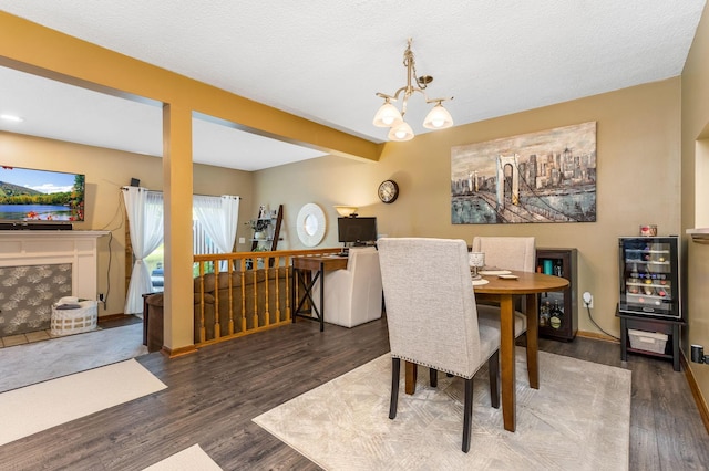 7179 Inverness Ct, Dublin, OH 43016 - dining room with wood finished floors, a chandelier, and wine cooler