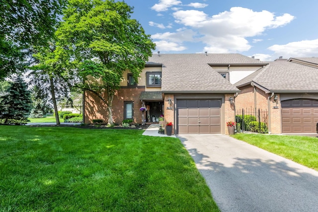 7179 Inverness Ct, Dublin, OH 43016 - view of front facade featuring brick siding, roof with shingles, concrete driveway, a front lawn, and an attached garage