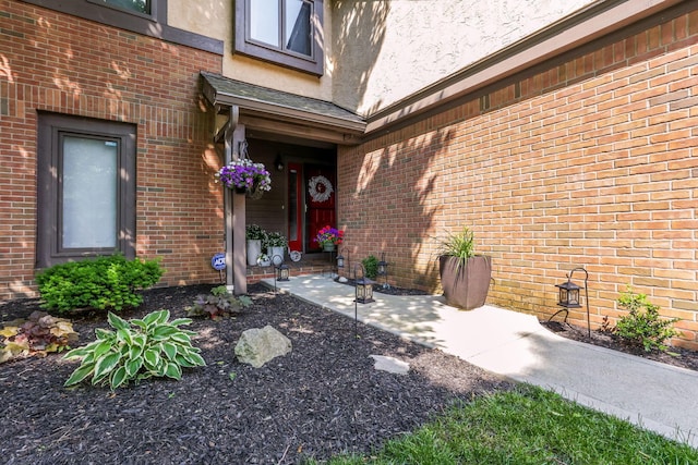 7179 Inverness Ct, Dublin, OH 43016 - view of exterior entry featuring stucco siding and brick siding