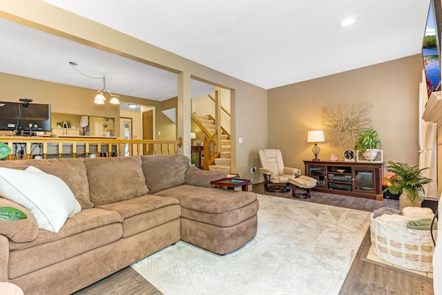 7179 Inverness Ct, Dublin, OH 43016 - living room with wood finished floors, stairway, and recessed lighting