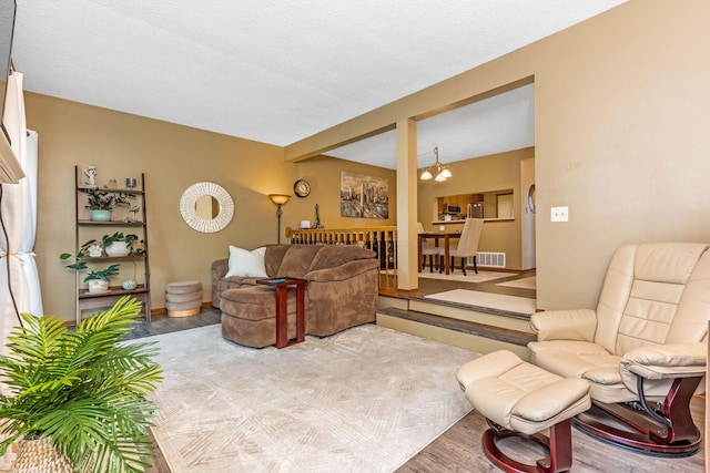 7179 Inverness Ct, Dublin, OH 43016 - living room featuring a chandelier and wood finished floors