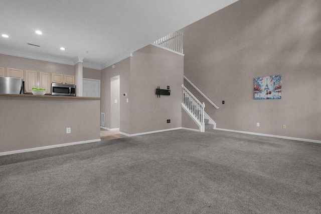 6221 Craughwell Ln, Dublin, OH 43017 - unfurnished living room with crown molding, baseboards, recessed lighting, light carpet, and stairway