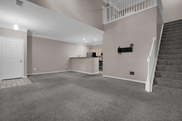 6221 Craughwell Ln, Dublin, OH 43017 - unfurnished living room with ornamental molding, carpet flooring, baseboards, stairway, and recessed lighting