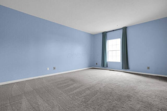 6221 Craughwell Ln, Dublin, OH 43017 - carpeted empty room with baseboards