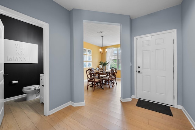 3834 Brody Dr, Grove City, OH 43123 - entryway with a chandelier, light wood-style floors, and baseboards
