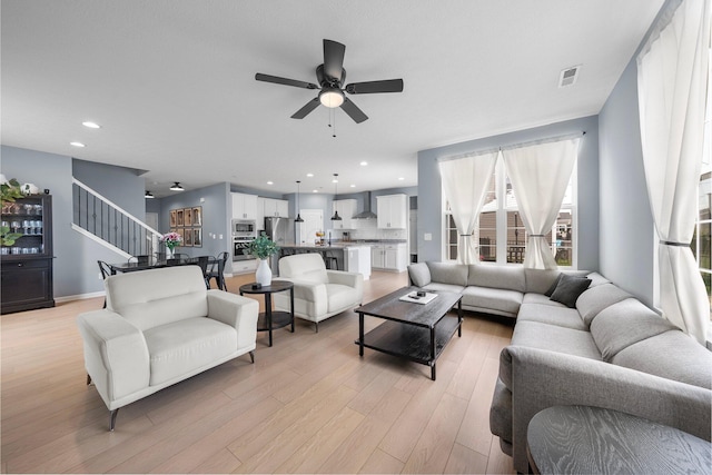 3834 Brody Dr, Grove City, OH 43123 - living room with a ceiling fan, light wood-style flooring, healthy amount of natural light, recessed lighting, and stairs