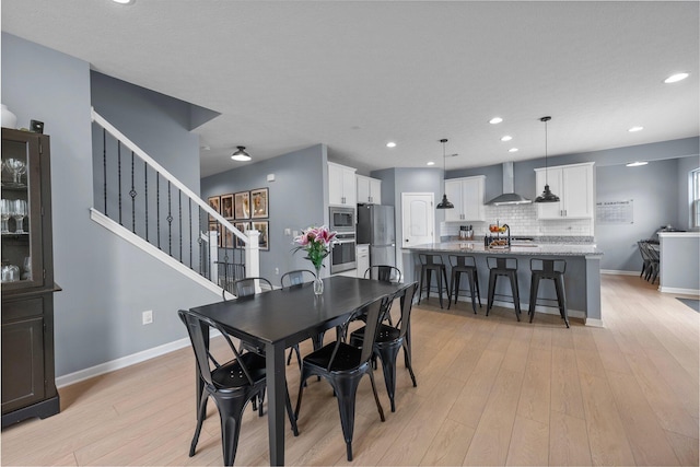 3834 Brody Dr, Grove City, OH 43123 - dining area with light wood-type flooring, baseboards, stairway, and recessed lighting