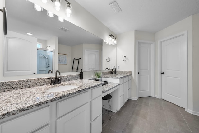 3834 Brody Dr, Grove City, OH 43123 - full bath with two vanities, a stall shower, baseboards, and tile patterned flooring