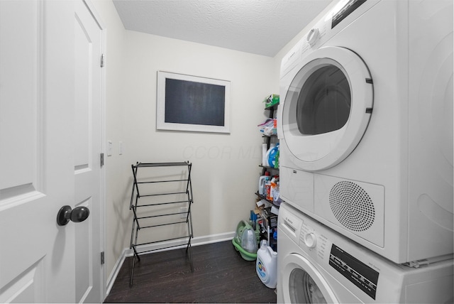 3834 Brody Dr, Grove City, OH 43123 - washroom featuring stacked washing machine and dryer, dark wood-type flooring, baseboards, and a textured ceiling