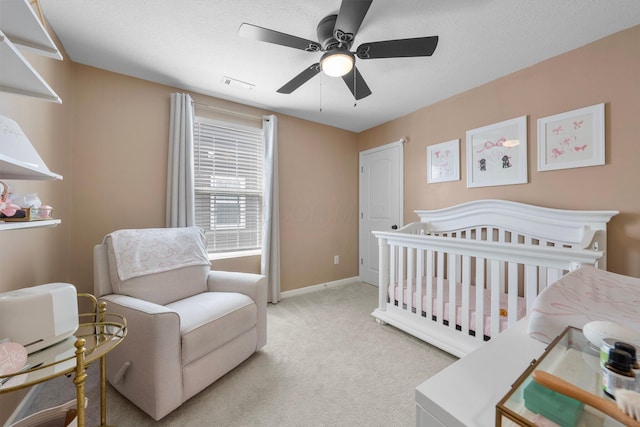 3834 Brody Dr, Grove City, OH 43123 - bedroom with a nursery area, light colored carpet, ceiling fan, and baseboards