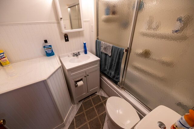 408 Olive St, Greenfield, OH 45123 - bathroom featuring toilet, vanity, and enclosed tub / shower combo