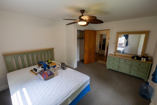 408 Olive St, Greenfield, OH 45123 - bedroom featuring dark colored carpet, a closet, a ceiling fan, and baseboards