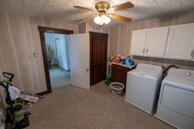 408 Olive St, Greenfield, OH 45123 - laundry room featuring cabinet space, washing machine and clothes dryer, light colored carpet, wood walls, and ceiling fan