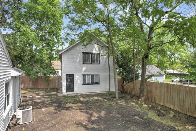 960 College Ave, Columbus, OH 43209 - rear view of house with cooling unit and a fenced backyard