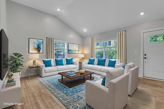960 College Ave, Columbus, OH 43209 - living area with light wood-style flooring, high vaulted ceiling, recessed lighting, and baseboards