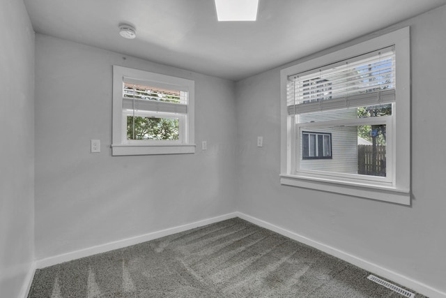 960 College Ave, Columbus, OH 43209 - spare room featuring baseboards and dark colored carpet