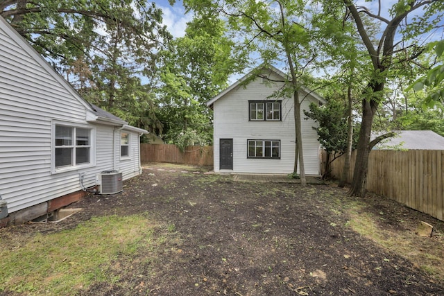 960 College Ave, Columbus, OH 43209 - rear view of house featuring central AC unit and a fenced backyard