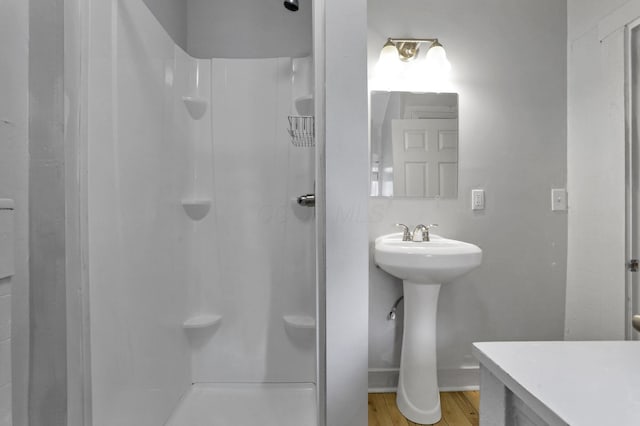 960 College Ave, Columbus, OH 43209 - bathroom with a shower stall and wood finished floors