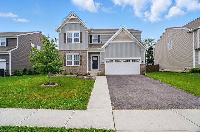459 Wingate Pl, Mount Sterling, OH 43143 - view of front of house with board and batten siding, brick siding, asphalt driveway, and a front yard