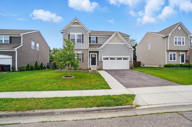 459 Wingate Pl, Mount Sterling, OH 43143 - view of front facade featuring board and batten siding, driveway, a front yard, brick siding, and a garage