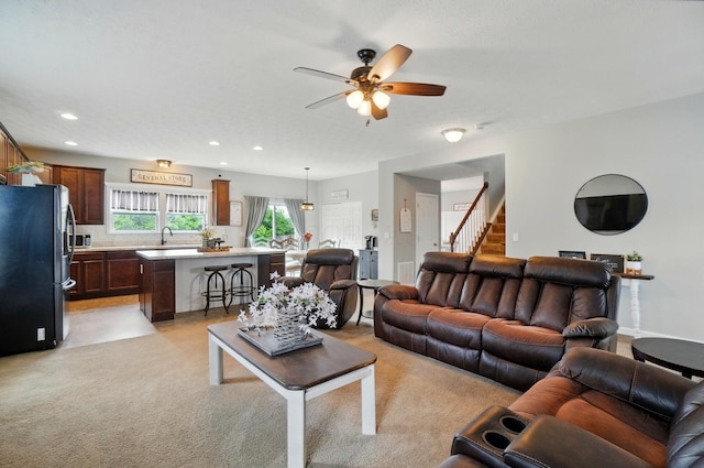 459 Wingate Pl, Mount Sterling, OH 43143 - living area featuring ceiling fan, light colored carpet, recessed lighting, and stairway