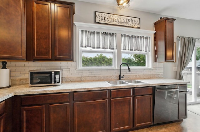 459 Wingate Pl, Mount Sterling, OH 43143 - kitchen featuring a sink, appliances with stainless steel finishes, light countertops, and backsplash