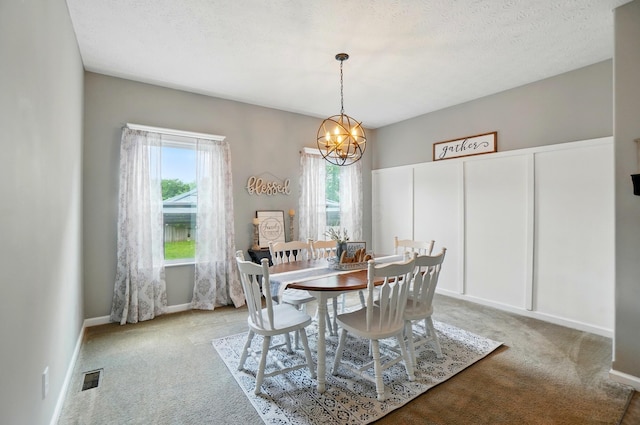 459 Wingate Pl, Mount Sterling, OH 43143 - dining room with light colored carpet, a chandelier, and baseboards