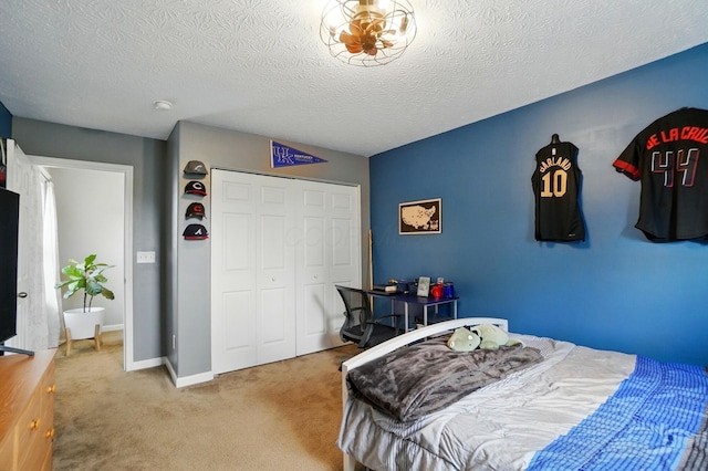 459 Wingate Pl, Mount Sterling, OH 43143 - bedroom with carpet, a closet, a textured ceiling, and baseboards