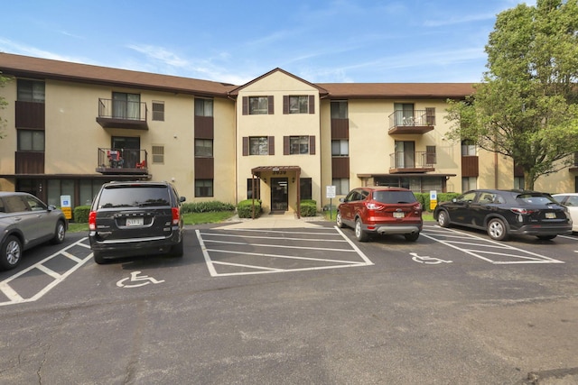 3939 Karl Rd Unit 206, Columbus, OH 43224 - view of building exterior featuring uncovered parking
