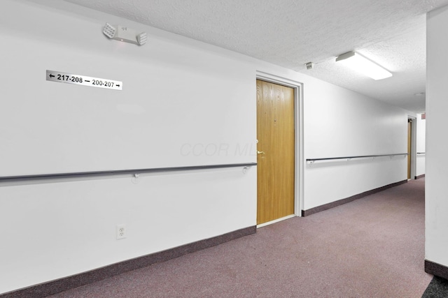 3939 Karl Rd Unit 206, Columbus, OH 43224 - carpeted empty room featuring a textured ceiling and baseboards