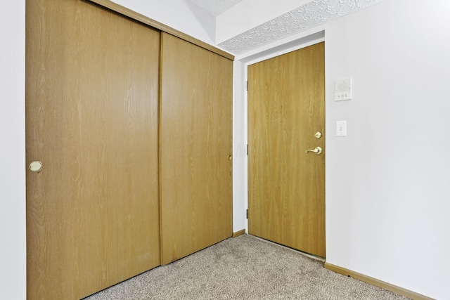 3939 Karl Rd Unit 206, Columbus, OH 43224 - unfurnished bedroom with light carpet, a closet, and baseboards