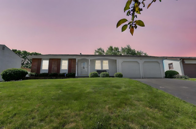 3723 Klibreck Dr, Columbus, OH 43228 - single story home with an attached garage, concrete driveway, a lawn, and brick siding