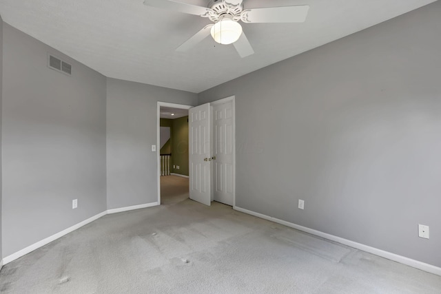1015 Harborton Dr, Columbus, OH 43228 - spare room featuring carpet floors, baseboards, and ceiling fan