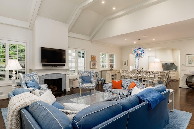 14 Lyonsgate Rd, Bexley, OH 43209 - living room with dark wood-type flooring, a fireplace with raised hearth, recessed lighting, arched walkways, and high vaulted ceiling