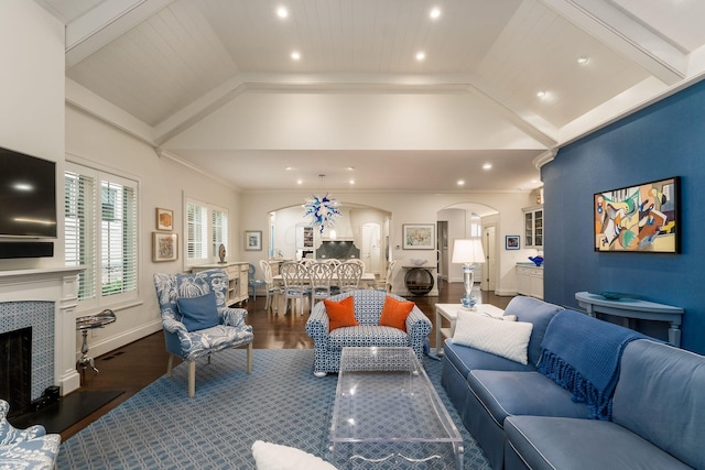 14 Lyonsgate Rd, Bexley, OH 43209 - living room with arched walkways, wood finished floors, a tiled fireplace, high vaulted ceiling, and recessed lighting