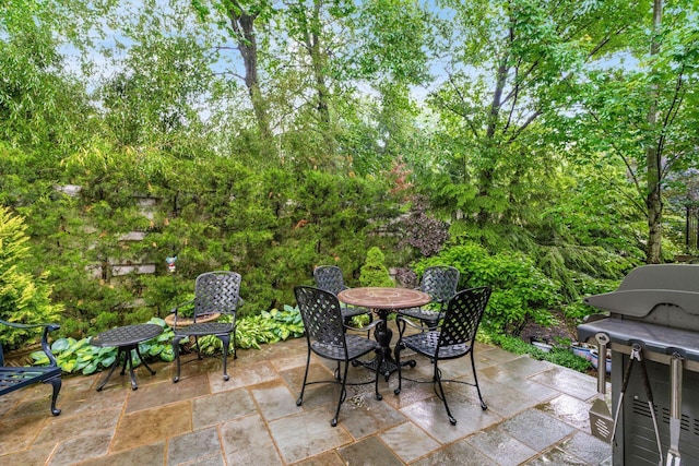 14 Lyonsgate Rd, Bexley, OH 43209 - view of patio with a grill, outdoor dining space, and view of scattered trees