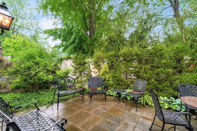 14 Lyonsgate Rd, Bexley, OH 43209 - view of patio with outdoor dining space and view of wooded area