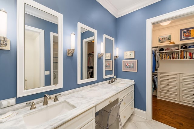 14 Lyonsgate Rd, Bexley, OH 43209 - full bathroom featuring double vanity, crown molding, a walk in closet, tile patterned floors, and baseboards