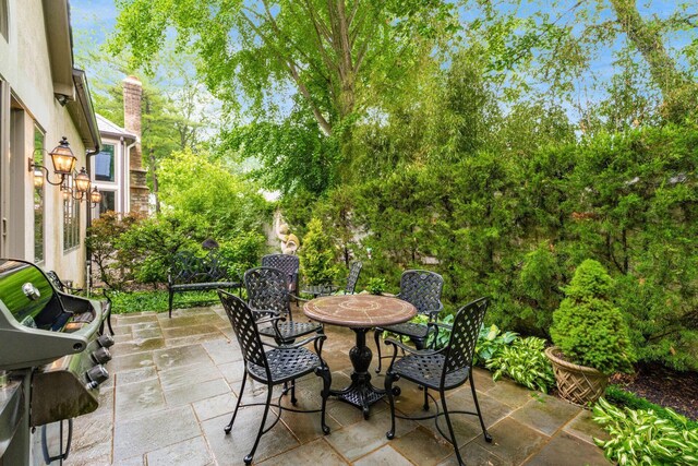 14 Lyonsgate Rd, Bexley, OH 43209 - view of patio / terrace featuring outdoor dining area and view of scattered trees