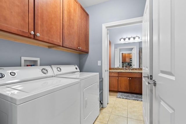 925 Ingleside Ave Unit 213, Columbus, OH 43215 - laundry area with cabinet space, washer and clothes dryer, and light tile patterned flooring