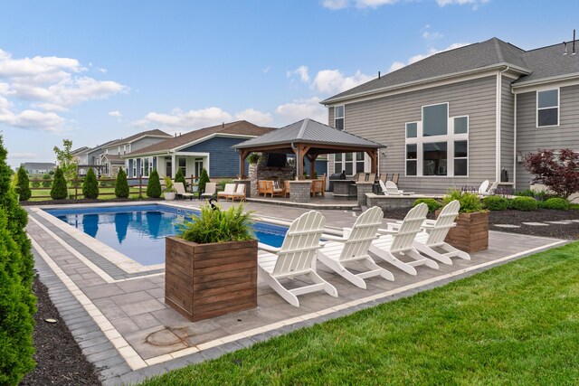 3669 Audubon Ave, Hilliard, OH 43026 - swimming pool featuring a gazebo, a patio, an outdoor kitchen, and an outdoor hangout area