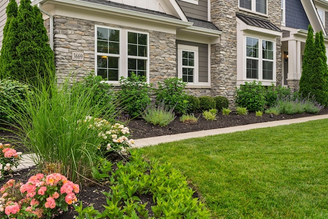 3669 Audubon Ave, Hilliard, OH 43026 - view of home's exterior with stone siding and a yard