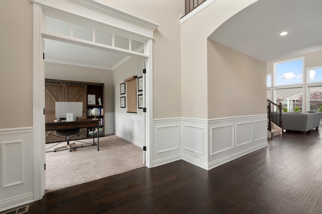 3669 Audubon Ave, Hilliard, OH 43026 - corridor with dark wood-style flooring, a wainscoted wall, arched walkways, a desk, and crown molding