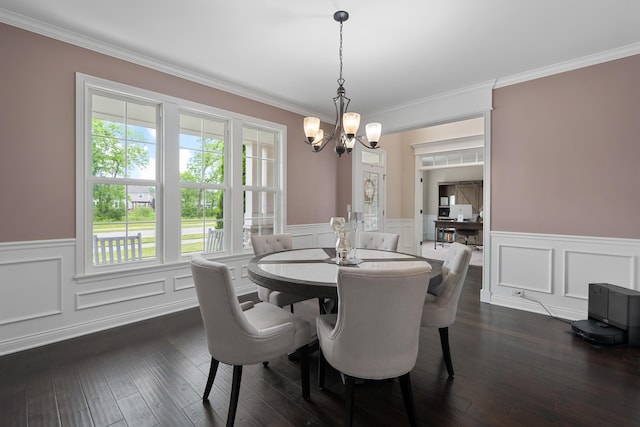 3669 Audubon Ave, Hilliard, OH 43026 - dining space featuring a chandelier, a wainscoted wall, plenty of natural light, ornamental molding, and dark wood-style flooring