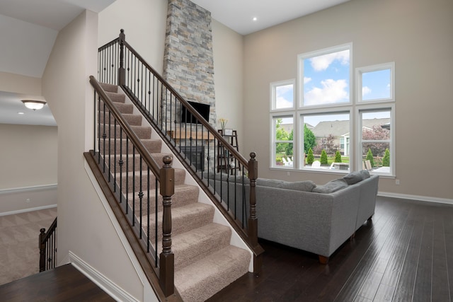 3669 Audubon Ave, Hilliard, OH 43026 - staircase with a towering ceiling, hardwood / wood-style floors, and baseboards